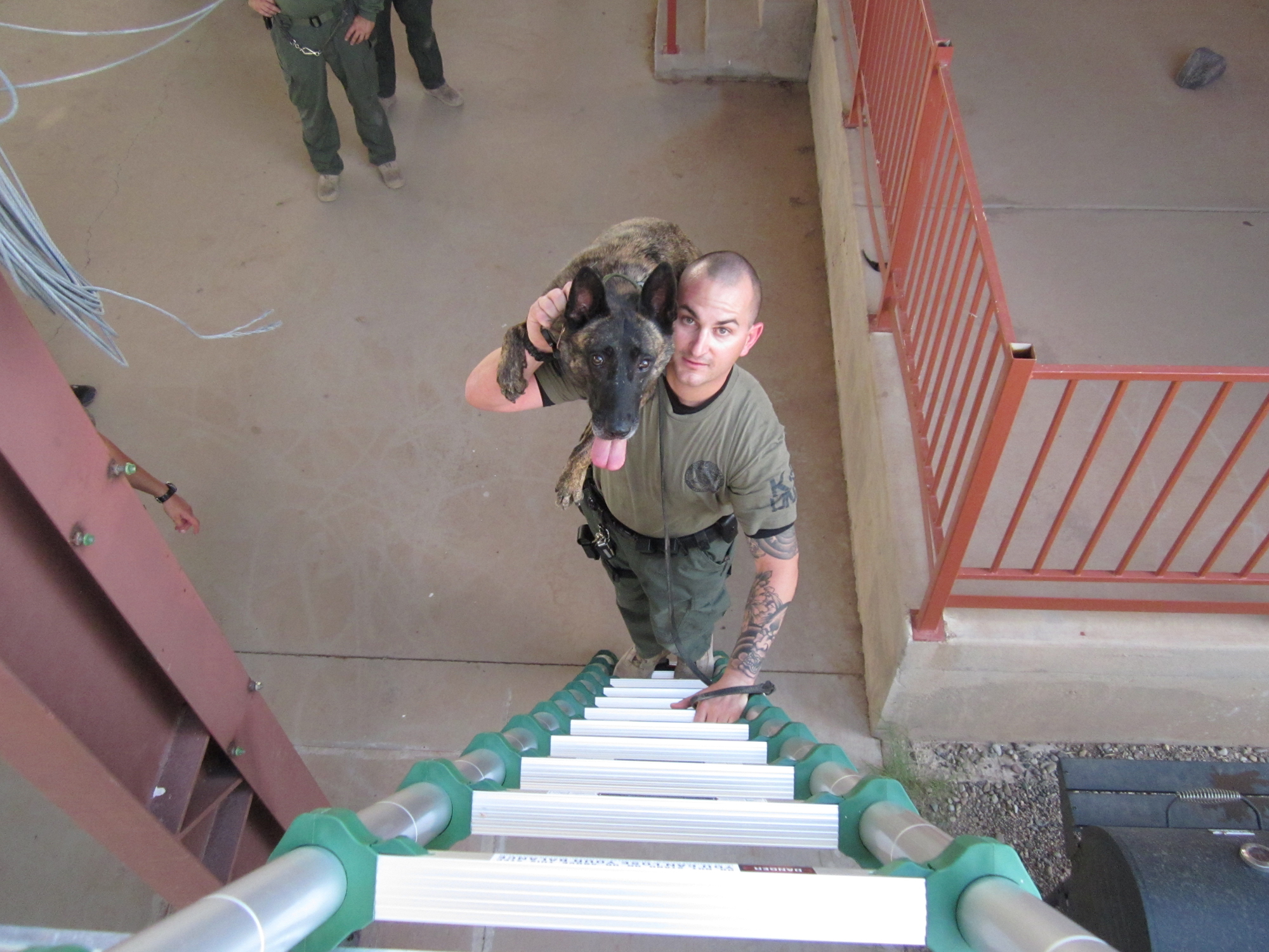 Pinal County Sheriff's Office Canine Unit posing with Xtend+Climb telescoping ladders